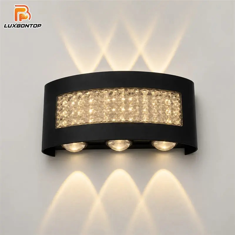 Black LED wall light casting warm up-and-down decorative beams